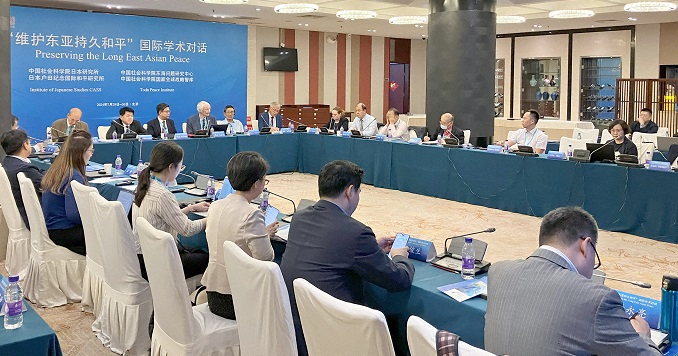 People sitting around a large conference table