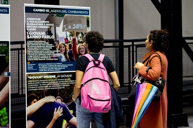 Two women looking at panels of an environmental exhibition.