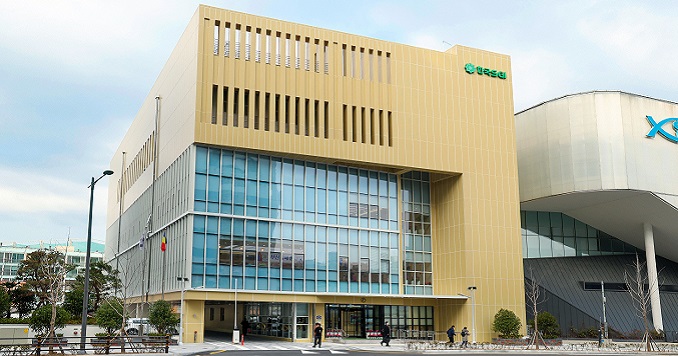 A large modern building in the central area of a city.